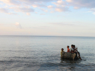 Indonesia, Bali, Kids playing with a Raft