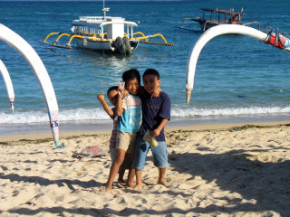 Indonesia, Bali, Padang Bay, Kids at the Beach with Boats