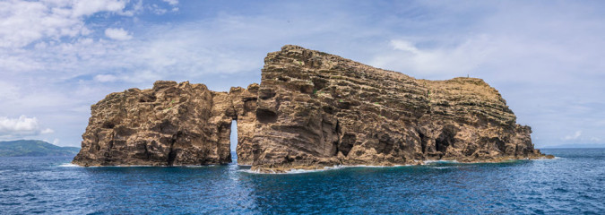 Azores, rocks of Ilheu Deitado in front of Pico