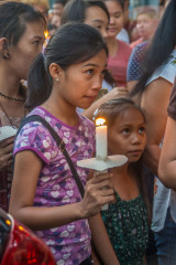 Philippines, Palawan, Puerto Princesa, girl with candle at easter procession