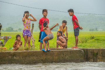 Philippines, Santa Ana, kids playing at water channel