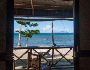 Philippines, sea canoe from beach cottage, Ticao Island beach