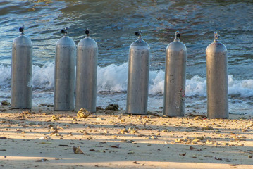 Philippines, dive tanks on the beach, Ticao Island