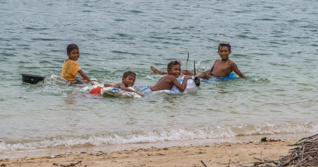 Philippines, kids playing at Ticao Island beach
