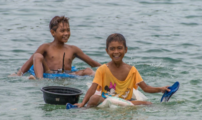 Philippines, kids playing at Ticao Island beach
