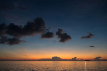 Philippines, sunset with lighthouse, Tubbataha reef