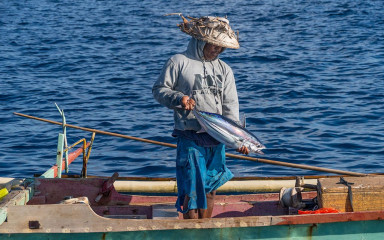Fisherman with fresh catch, Bunaken Island, Manado, Indonesia